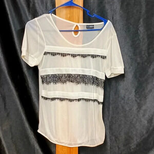 Size medium day trip see-through material beige top with black Fringe
